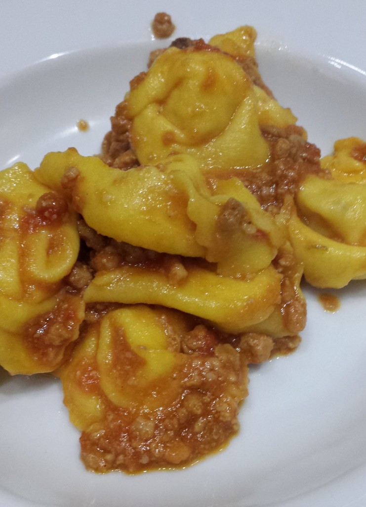 Cappateelli, or little hats are delicious cheese and herb filled pasta "hats" in Ravenna, here served in a meat ragu.