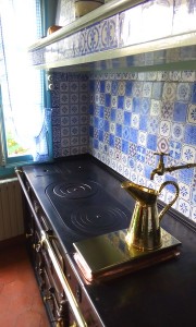 Blue and white Rouen tiles adorn the backsplash in Monet's Kitchen.